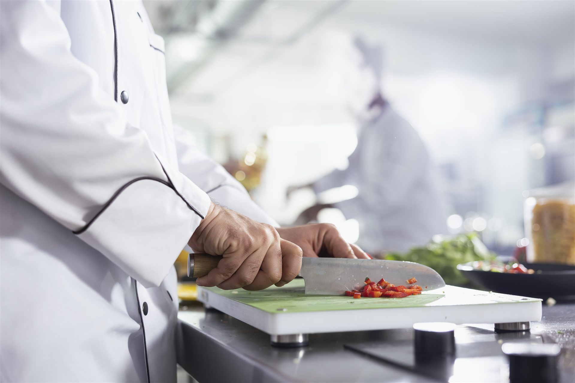 Chef preparing fresh vegetables in a professional kitchen